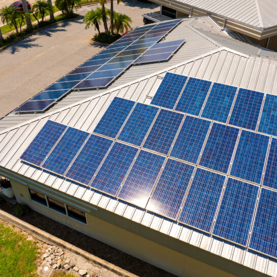 Home roof with blue solar photovoltaic panels for producing clean ecological electric energy. Investing in renewable electricity for retirement income Home roof with blue solar photovoltaic panels for producing clean ecological electric energy. Investing in renewable electricity for retirement income.
